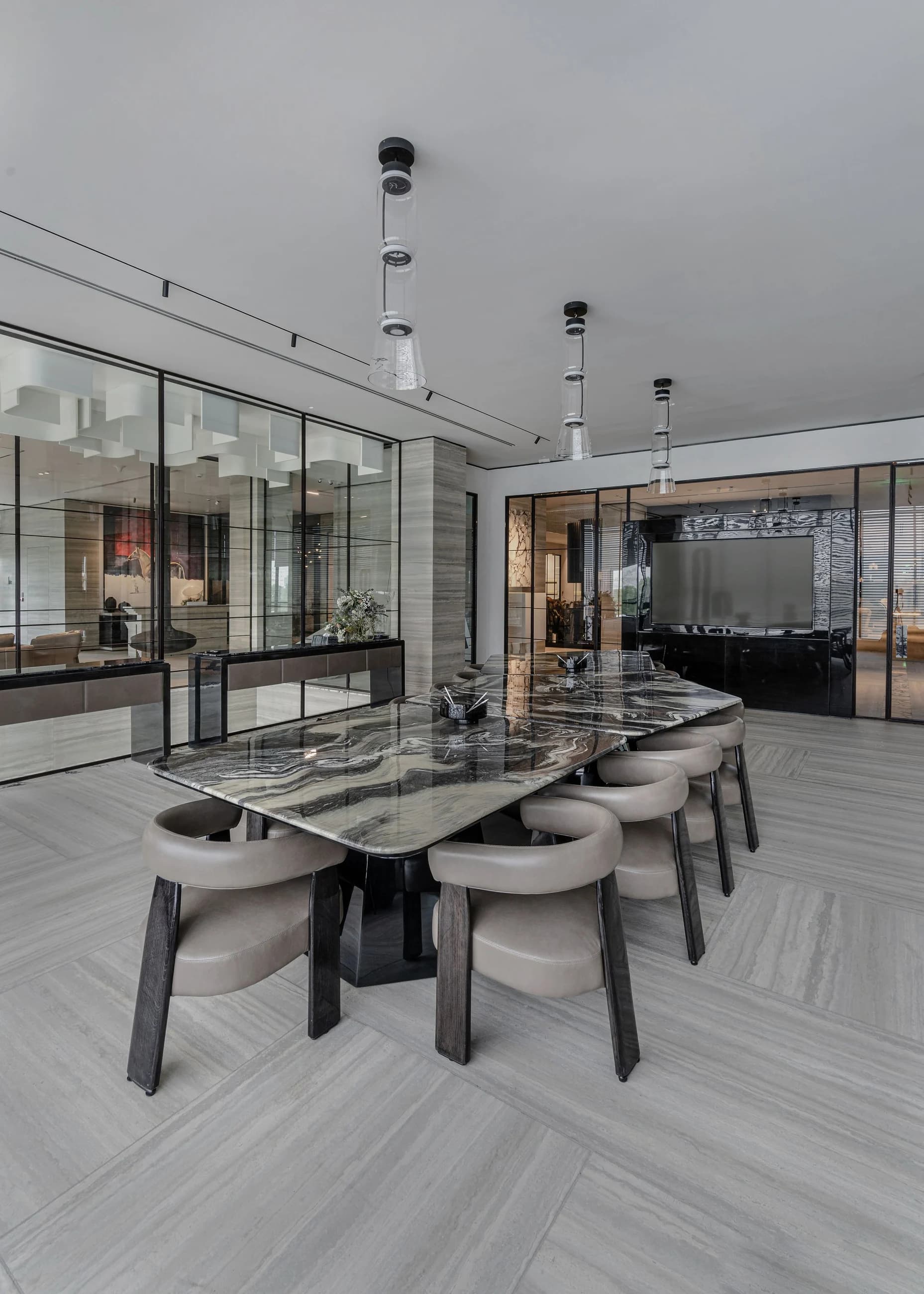 Completed commercial meeting room with glass partitions, coordinated lighting and patterned flooring