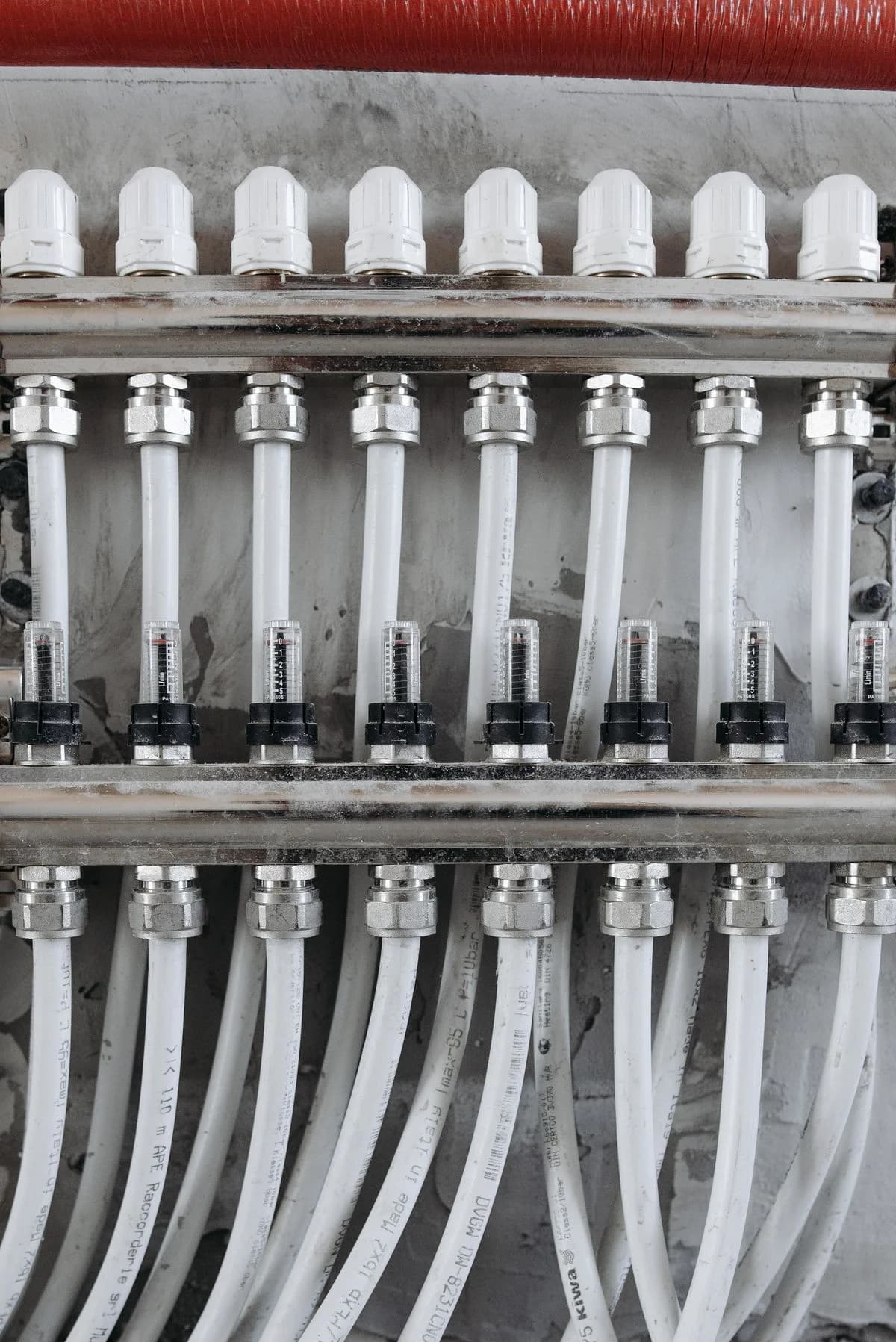 Plumbing distribution manifold with valves, flow meters and pipe connections