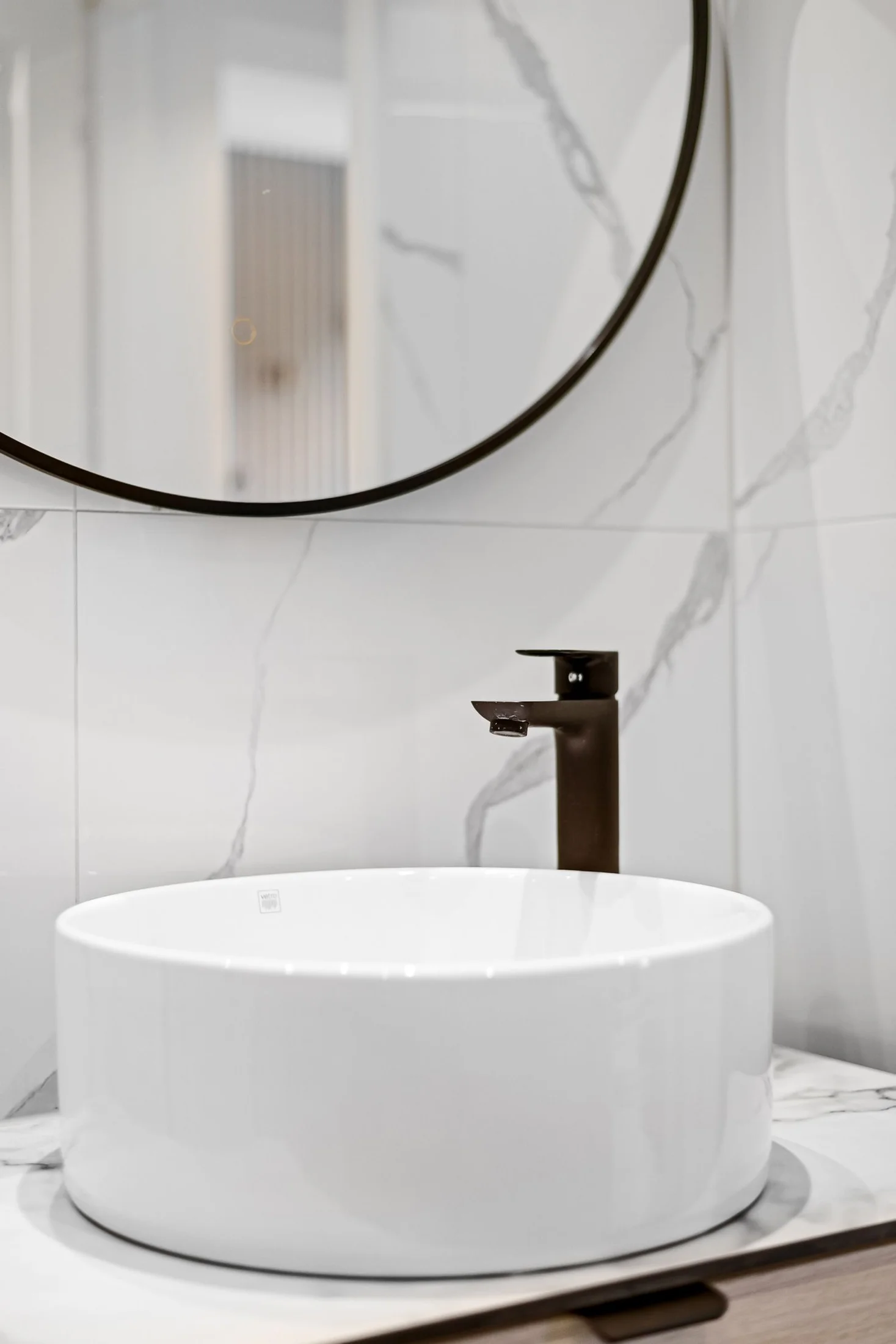 Installed restroom basin with a mixer tap