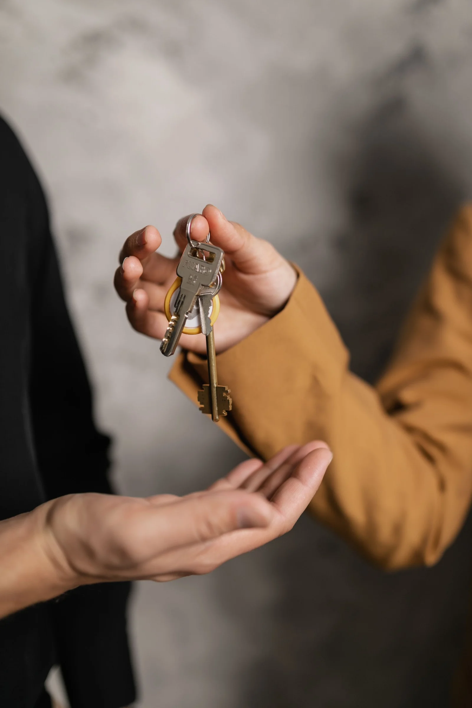 Apartment keys being handed to a resident