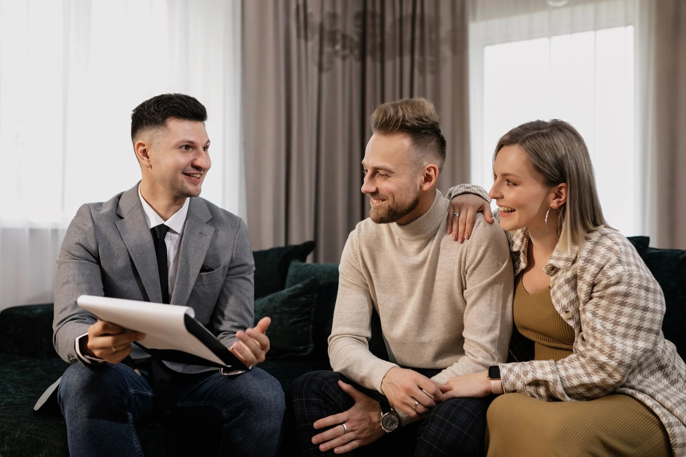 Property advisor listening to clients during a seated consultation